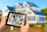 hands holding a tablet showing a real estate listing